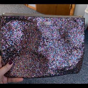 Multi colored clutch. Used twice. In perfect condition. Zips.